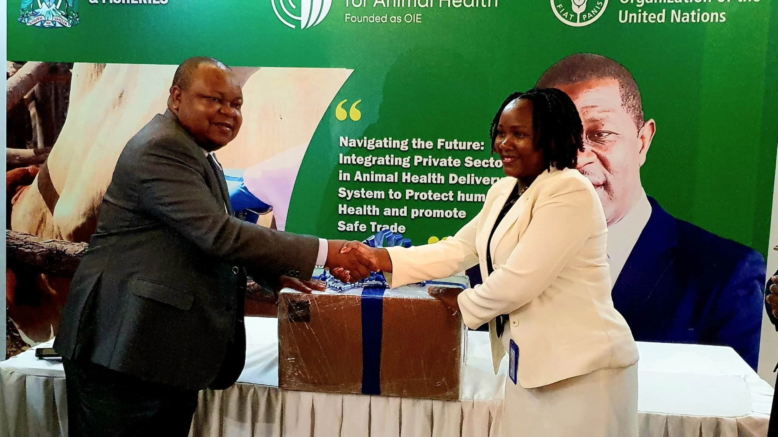 The FAO ECTAD Country Team Lead, Stella Kiambi (R), pictured in Arusha city yesterday presenting to Livestock and Fisheries ministry permanent secretary Prof Riziki Shemdoe part of a consignment of 3.9 million doses of rinderpest vaccine for goats.