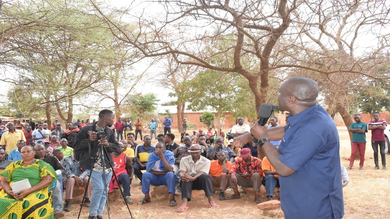 Mkalama district commissioner Moses Machali addresses residents of Mwangeza ward yesterday, part of the thrust being the challenges they commonly grapple with. 