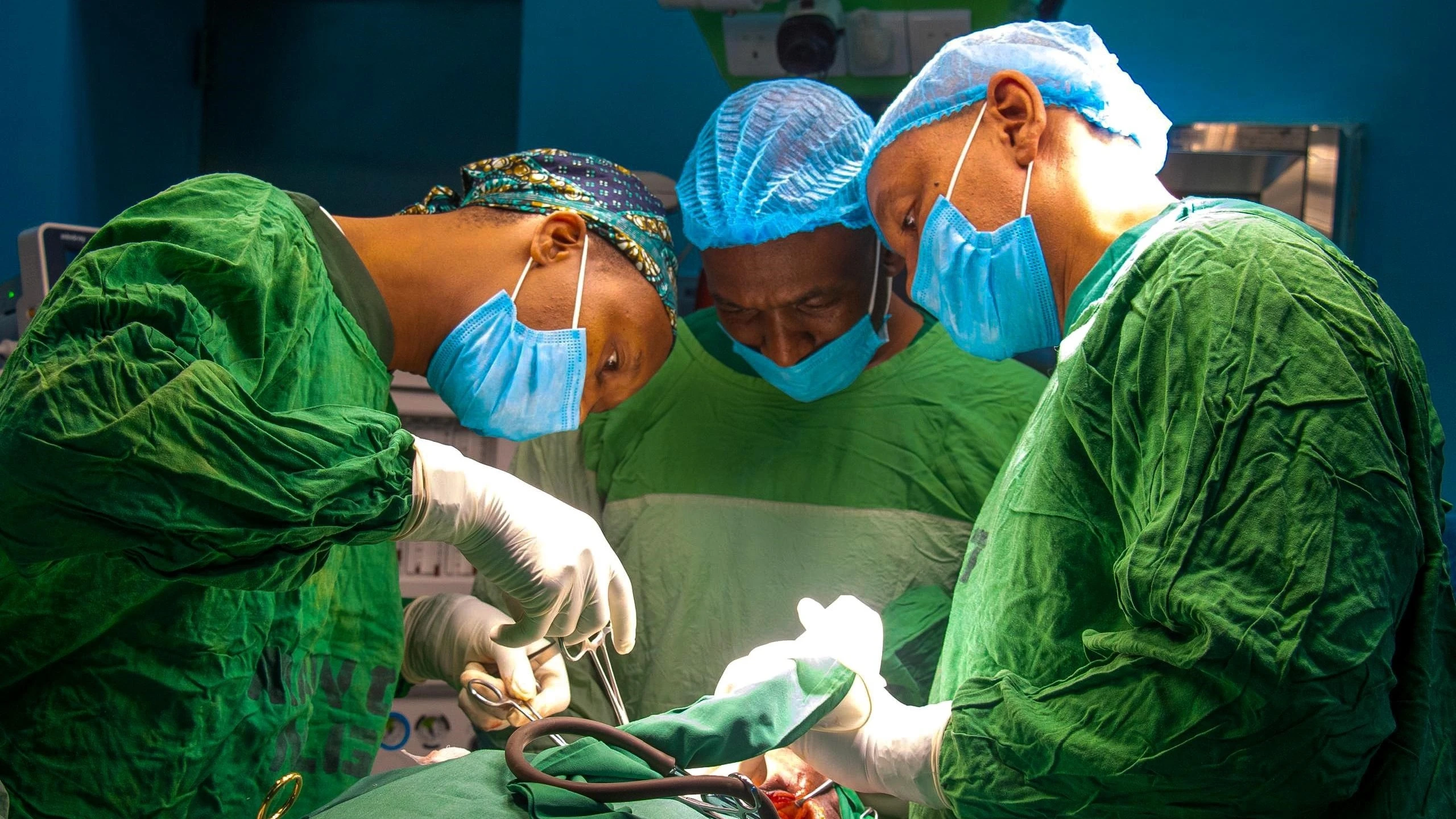 Muhimbili National Hospital specialists pictured at the weekend performing throat surgery on Maliki Hashimu (5) of Dar es Salaam’s Goba suburb, who was injured on the night of last Monday.