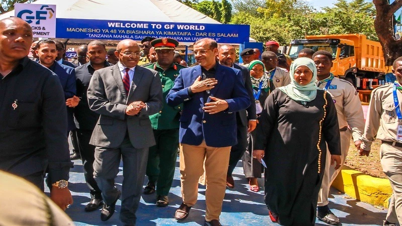 Zanzibar President Dr Hussen Mwinyi listens to Mehboob Karmal (2nd R) when he was visiting exhibitors during the just ended Dar es Salaam International Trade Fair held at Sabasaba Grounds in Dar es Salaam.