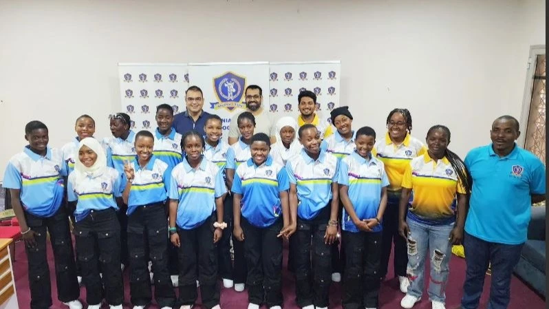 Tanzania Cricket Association (TCA) vice chairman Ashish Nagewadia (back row, C), poses for a photo with the national U-19 women's cricket squad during the farewell ceremony for the side ahead of its trip to Uganda to take part in the Bilateral T20 Series