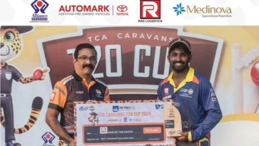 

Aurobindo AKSC's cricketer Ajith Augastin (R) is pictured receiving the Ras Logistics Man of the Match prize from Mohandas K, one of the founding members of Caravans Cricket Club, after this season's Petrofuel TCA Caravans T20 Cup 
