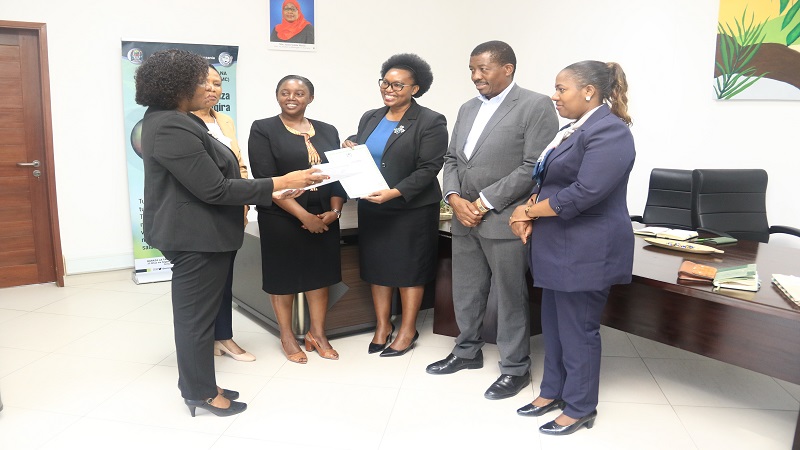 National Environment Management Council (NEMC), Director General Dr. Immaculate Semesi (3rd R) speaks  to the council’s staff yesterday in Dar es Salaam after receiving the environmental impact assessment certificate (EIA) 