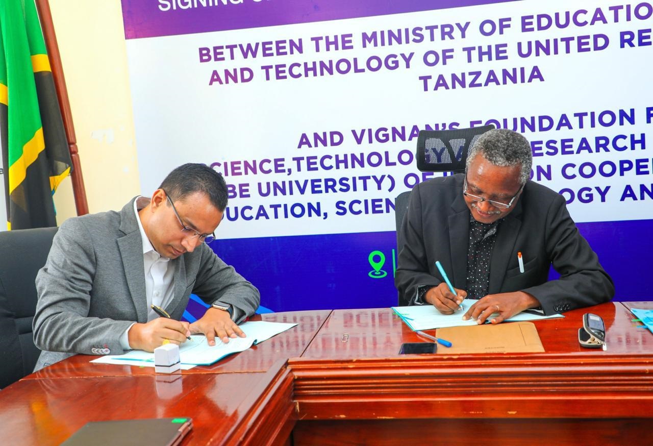 Education, Science and Technology ministry acting permanent secretary Dr Lyabwete Mtahabwa (R) exchanges documents with Srikant Nandigam, CEO of India’s Vignan University, in Dodoma city shortly after the July 18 signing of an MoU 