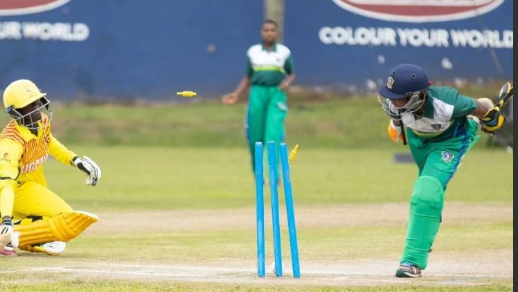 
Tanzania's U-19 women's cricket team wicketkeeper Saumu Deo (R) runs Uganda U-19 women's team batter out during the 2024 Bilateral T20 Series clash in Kampala on Tuesday. Uganda won by nine runs.