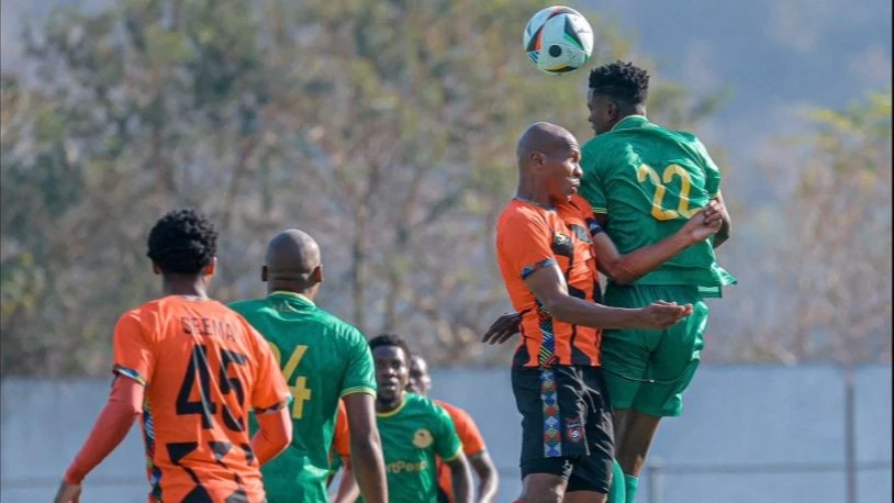 Young Africans and TS Galaxy players fight for the ball during their friendly match at Kanyamazane Stadium in Nelspruit, South Africa on Wednesday. Young Africans won 1-0. 