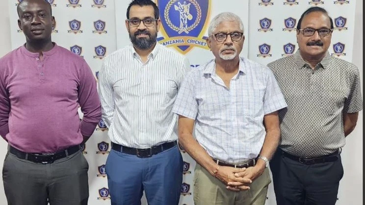 Tanzania Cricket Association (TCA) Chairman Balakrishna Sreekumar (R) poses for a photo with the association's vice chairman Ashish Nagewadia (2nd L), CEO Hamisi Abdallah (L), and a reputed cricket stakeholder Girdharbhai Pindolia at a ceremony