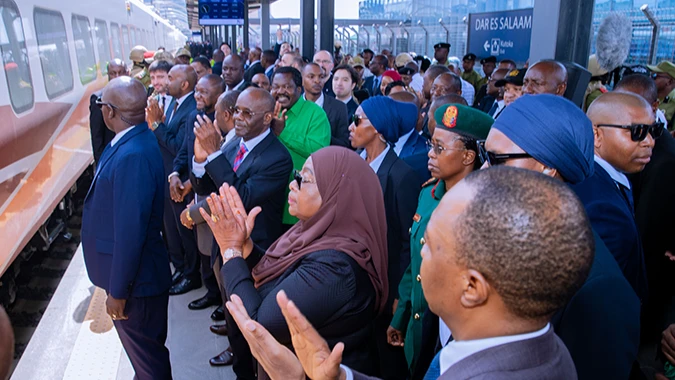 President Samia Suluhu Hassan leads the clapping in Dodoma city yesterday shortly after flagging off the grand launch of Standard Gauge Railway electric train transport services for the Dar es Salaam-Morogoro-Dodoma stretch. 