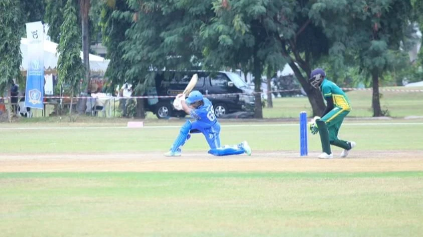 Tanzania's U-19 men's cricket squad's batsman (L) puts his prowess to show during the ICC U-19 Men's World Cup Qualifier Africa Division 2 clash against Nigeria held in Dar es Salaam last weekend.