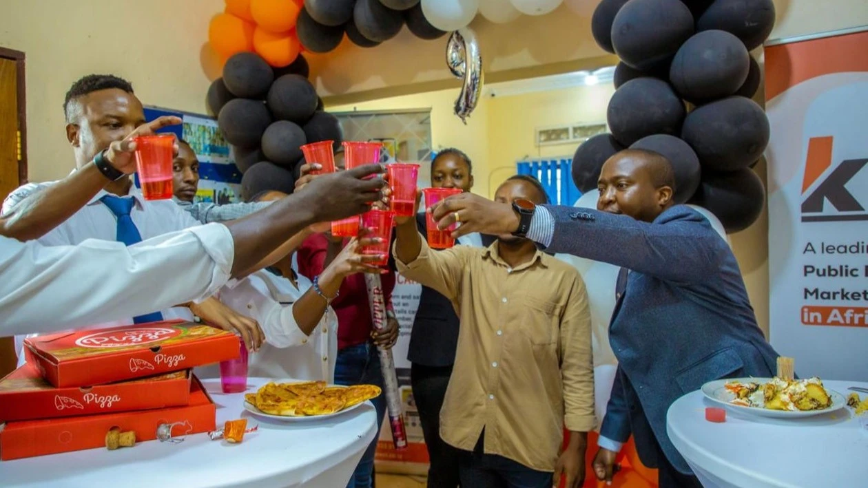 
The Koncept Group Founder and Chief Executive Officer Krantz Mwantepele (R) toasts with a cross-section of the company’s employees during an event to commemorate the company’s 9th anniversary in Dar es Salaam.