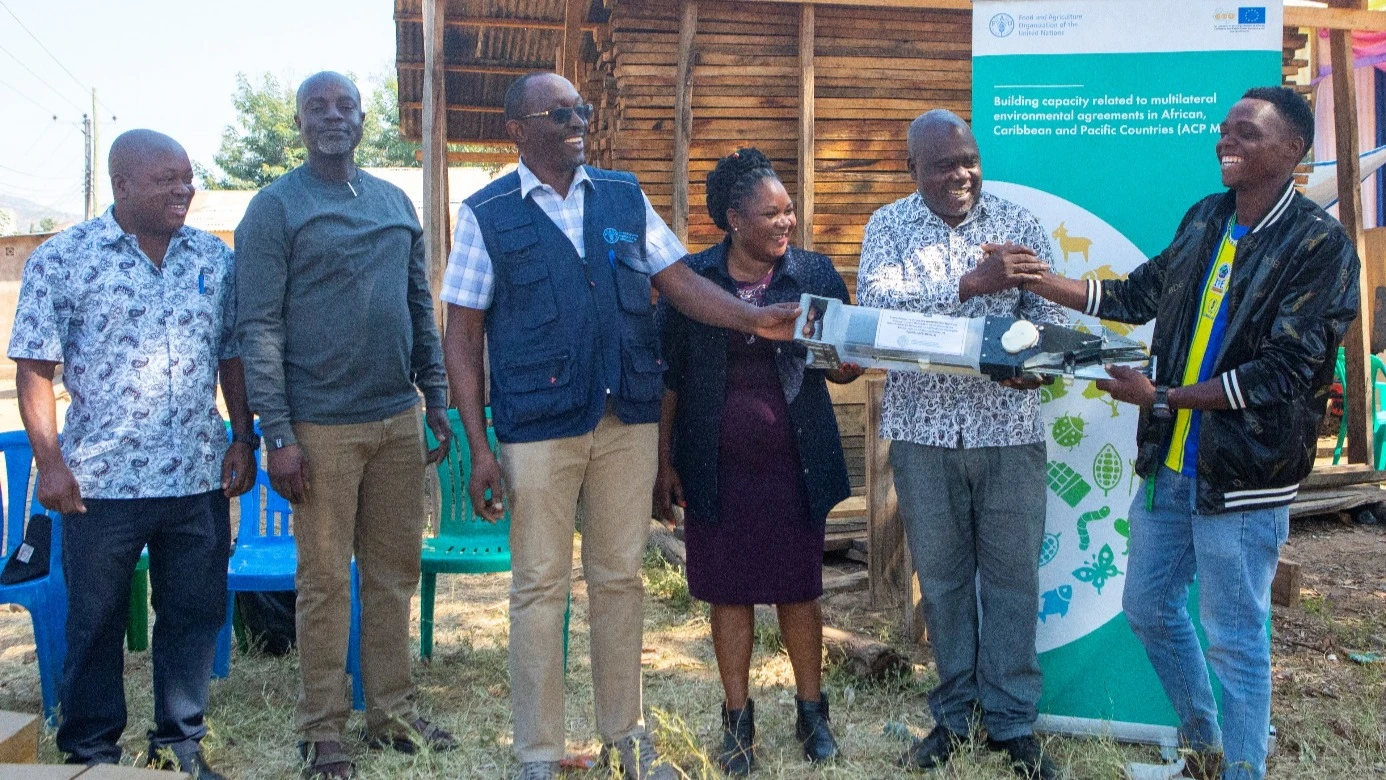 A moment of joy as farmers receive modern planting tools.