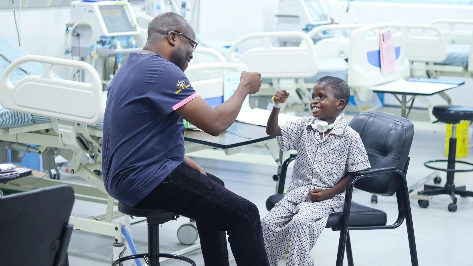 Dr Namala Mkopi, a Muhimbili National Hospital (MNH) paediatric intensivity specialist, plays with Maliki Hashim (6) before he was discharged yesterday. 