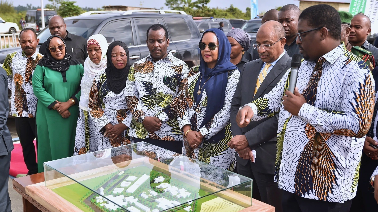 President Dr Hussein Ali Mwinyi listens to Omar Said Shaban (R), the Trade and Industrial Development minister for Zanzibar, giving details on industrial construction drawings in the Dunga Zuze industrial area of the Unguja Central District yesterday.