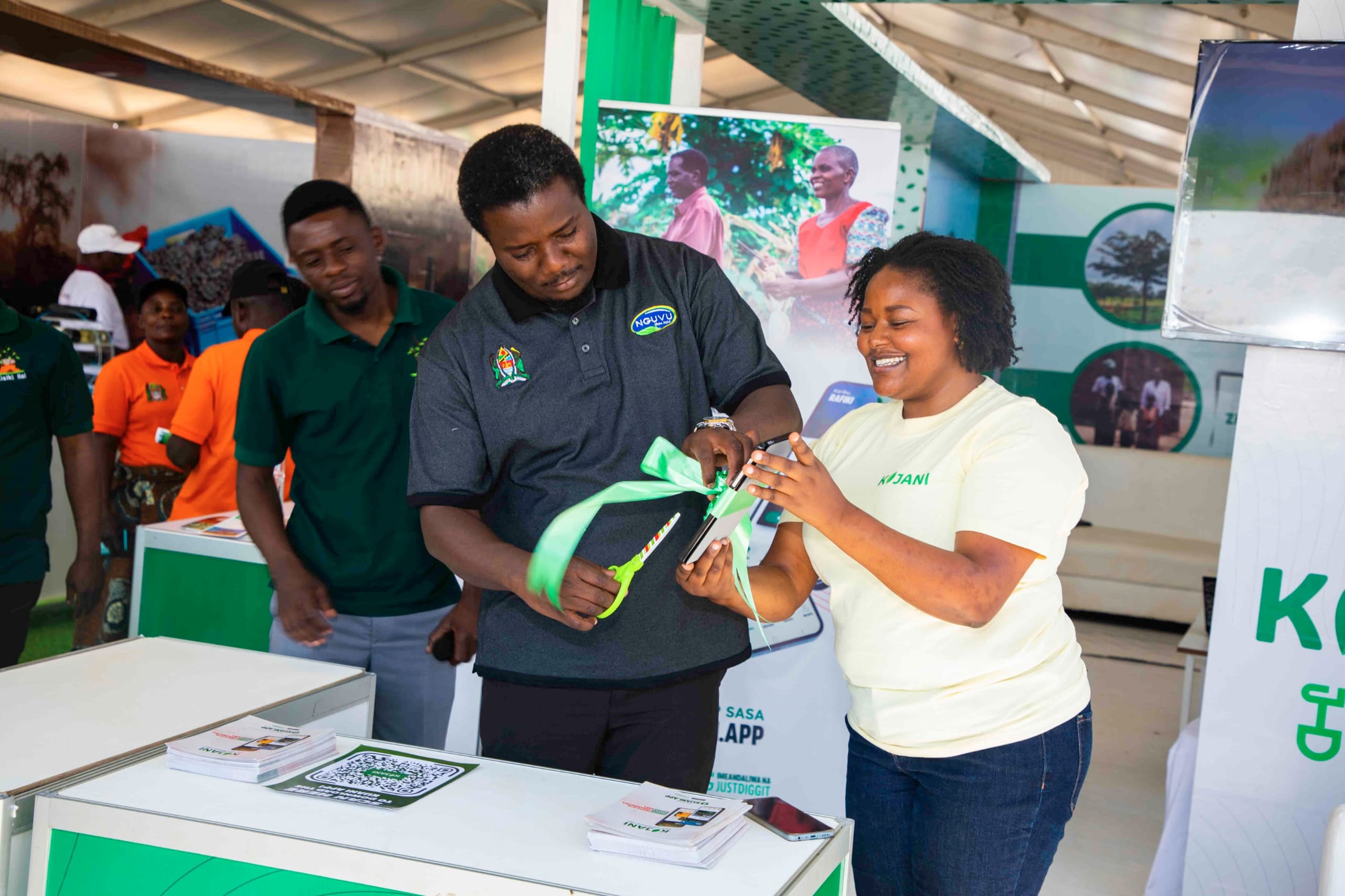 Agriculture deputy minister David Silinde (2nd-R) cuts the ribbon to launch Green App at Nane Nane Nzuguni grounds in Dodoma Urban District yesterday. 