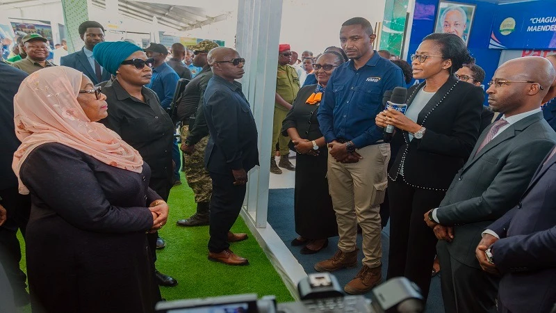 

NMB Bank CEO Ruth Zaipuna (2nd-R) pictured yesterday briefing President Samia Suluhu Hassan at one of the pavilions at the climax of this year’s edition of the Nane Nane (Farmers’ Day) agricultural exhibition held at a national level at Nzuguni grounds 