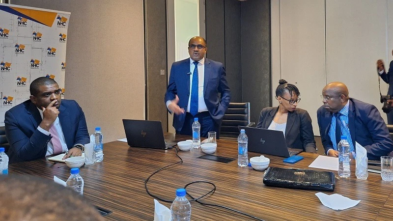 National Housing Corporation director general Hamad Abdalah explains a point on the firm’s operations to Lands, Housing and Human Settlements Development minister Deogratius Ndejembi (L), who visited the NHC offices in Dar es Salaam yesterday. 