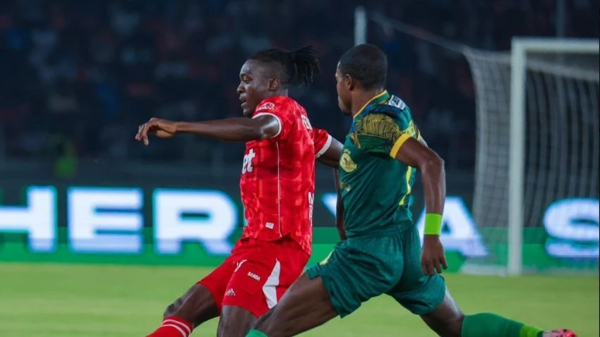 Simba midfielder Deborah Fernandez controls the ball watched closely by Young Africans winger Max Nzengeli during their Community Shield semi-final match held at the Benjamin Mkapa Stadium on Thursday. Young Africans won 1-0. 