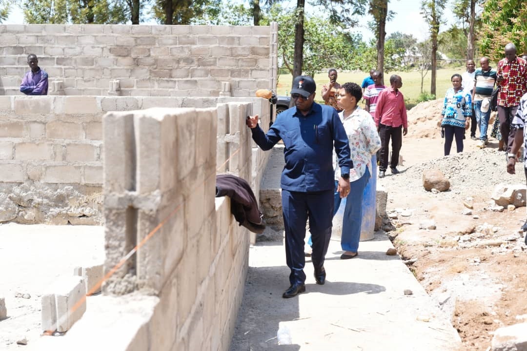 Col. Evans Mtambi, the Mara regional commissioner, inspects Ngoreme secondary school dormitory, issuing instruction to Serengeti District Council director Dr Maulid Madeni to complete the construction in six week. 