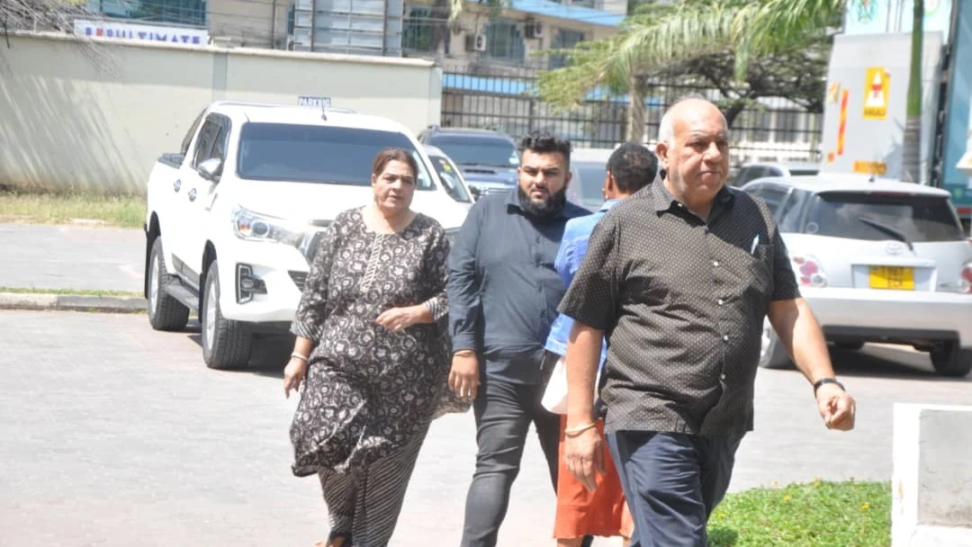 Bharat Nathwani in the front and his wife Sangita Nathwani in the back entering the Kisutu Resident Magistrate's Court in Dar es Salaam to hear the case facing them for injuring their neighbor.