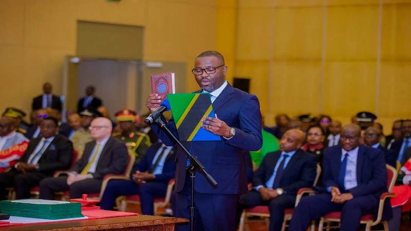 Newly appointed Attorney General Hamza Johari takes the oath of office before President Samia Suluhu Hassan at State House in Dar es Salaam yesterday. He was until this Wednesday Director General of the Tanzania Civil Aviation Authority