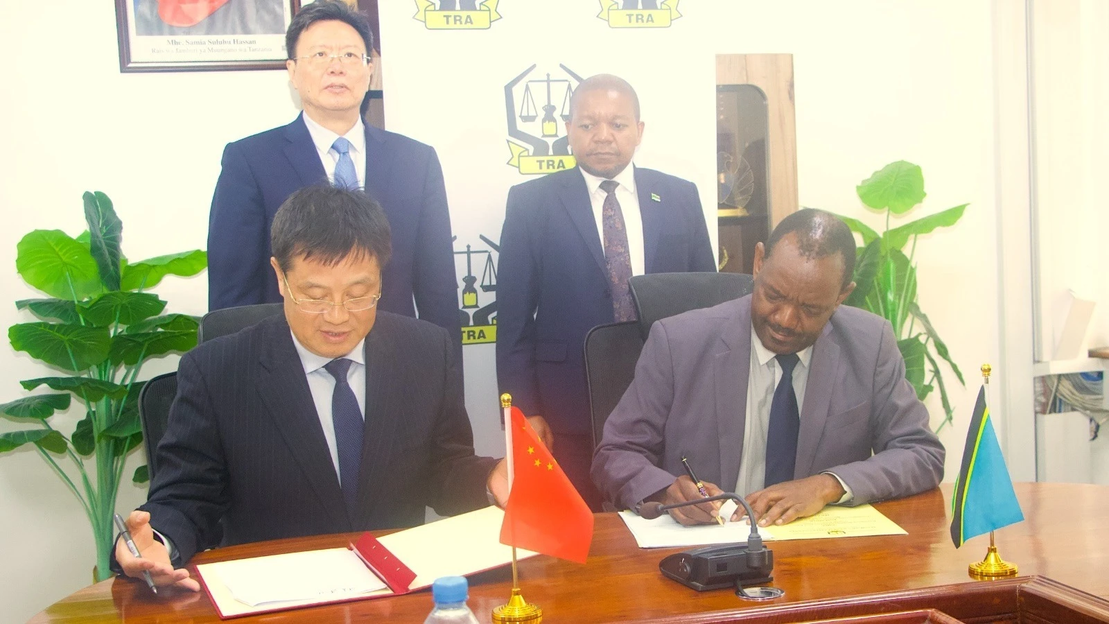 
Tanzania Revenue Authority commissioner general Yusuph Mwenda (standing-R) and China’s Customs Authority minister Yu Jianhua pictured in Dar es Salaam at the weekend 