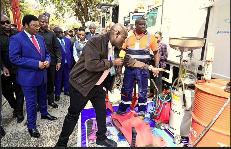 Prime Minister Kassim Majaliwa being shown working tools for motor vehicles repair at the Tanzania Electrical, Mechanical and Electronics Services Agency (TEMESA) by the technical and maintenance director Hassan Kalonda. 