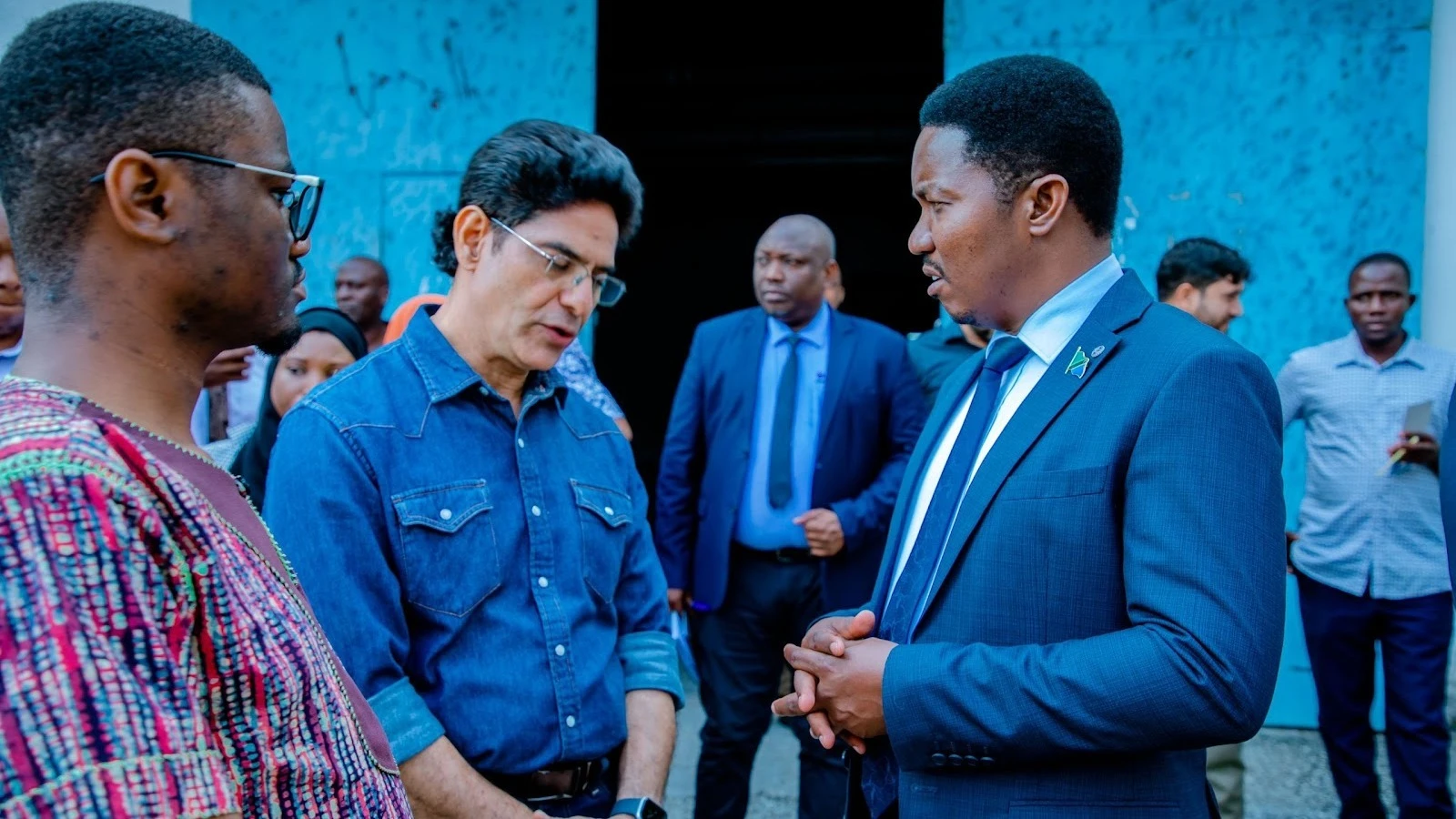 Industry and Trade minister,Dr Selemani Jafo (right) speaks with AFRITEX Textile Mills director Pushp Vir Singh (second left) immediately after paying a visit to Tanga,the industry is not functioning for a number of years .