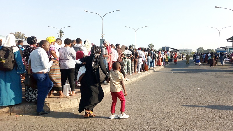 A long queue of passengers waits for the Bus Rapid Transit (BRT) transport at Mwezi Mwisho Commuter bus stand in Ubungo Municipality, Dar es Salaam yesterday. 