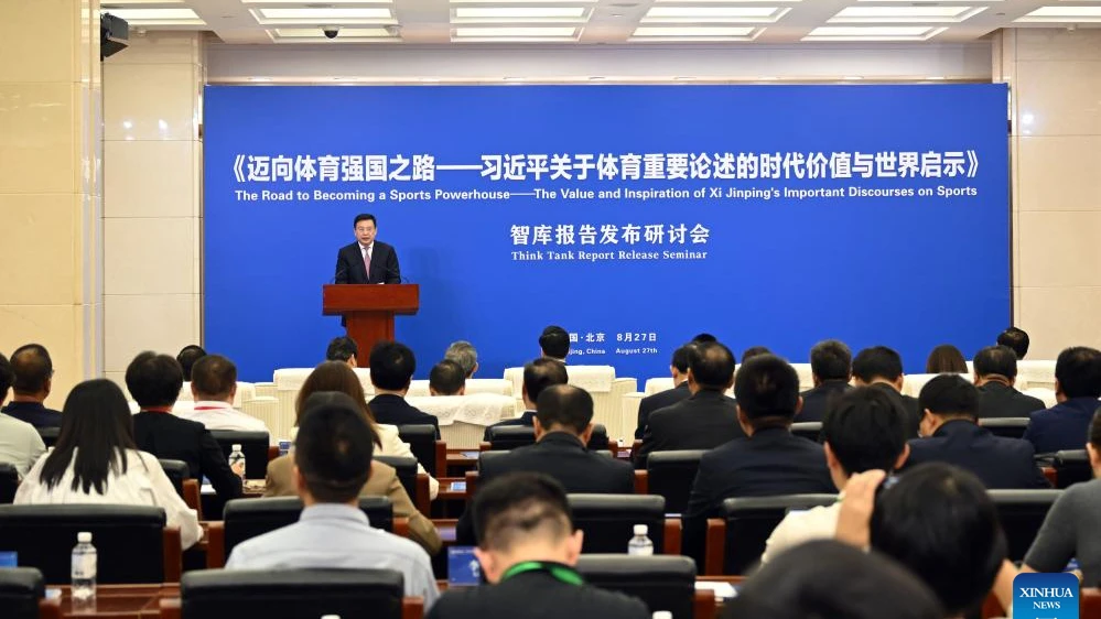 Fu Hua, president of Xinhua News Agency and chairman of the academic committee of Xinhua Institute, addresses the launch ceremony of a think tank report titled "The Road to Becoming a Sports Powerhouse 