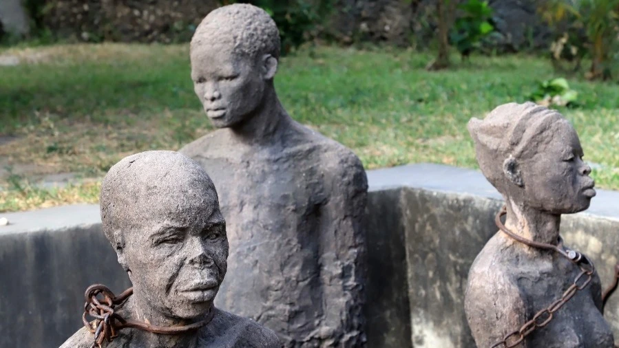 Three of the five statues chained around their necks to symbolize the brutality endured by Africans during the slave trade period in Zanzibar.

