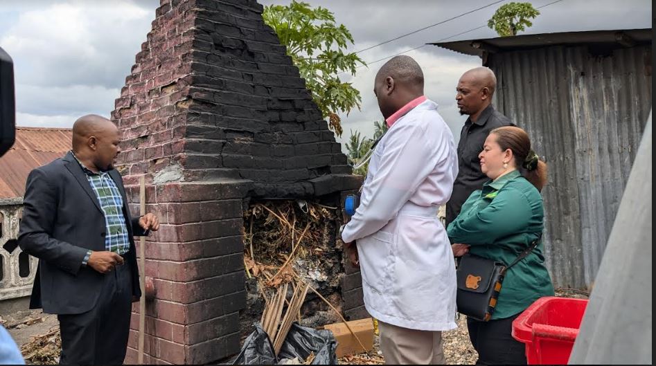 Kinondoni Municipality deputy mayor Michael Urio (L) inspects a waste incineration pit at the Tandale Health Centre in Dar es Salaam yesterday during a visit to Tandale Ward.