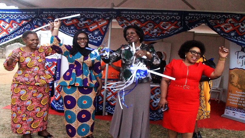 Dodoma Regional Commissioner Rosemary Senyamule (2nd R) and Kondoa DC Fatma Nyangasa (2nd L) cut a ribbon to inaugurate the 7th Gender Festival, a three-day event taking place in the district, organized by the Tanzania Gender Networking Programme (TGNP).