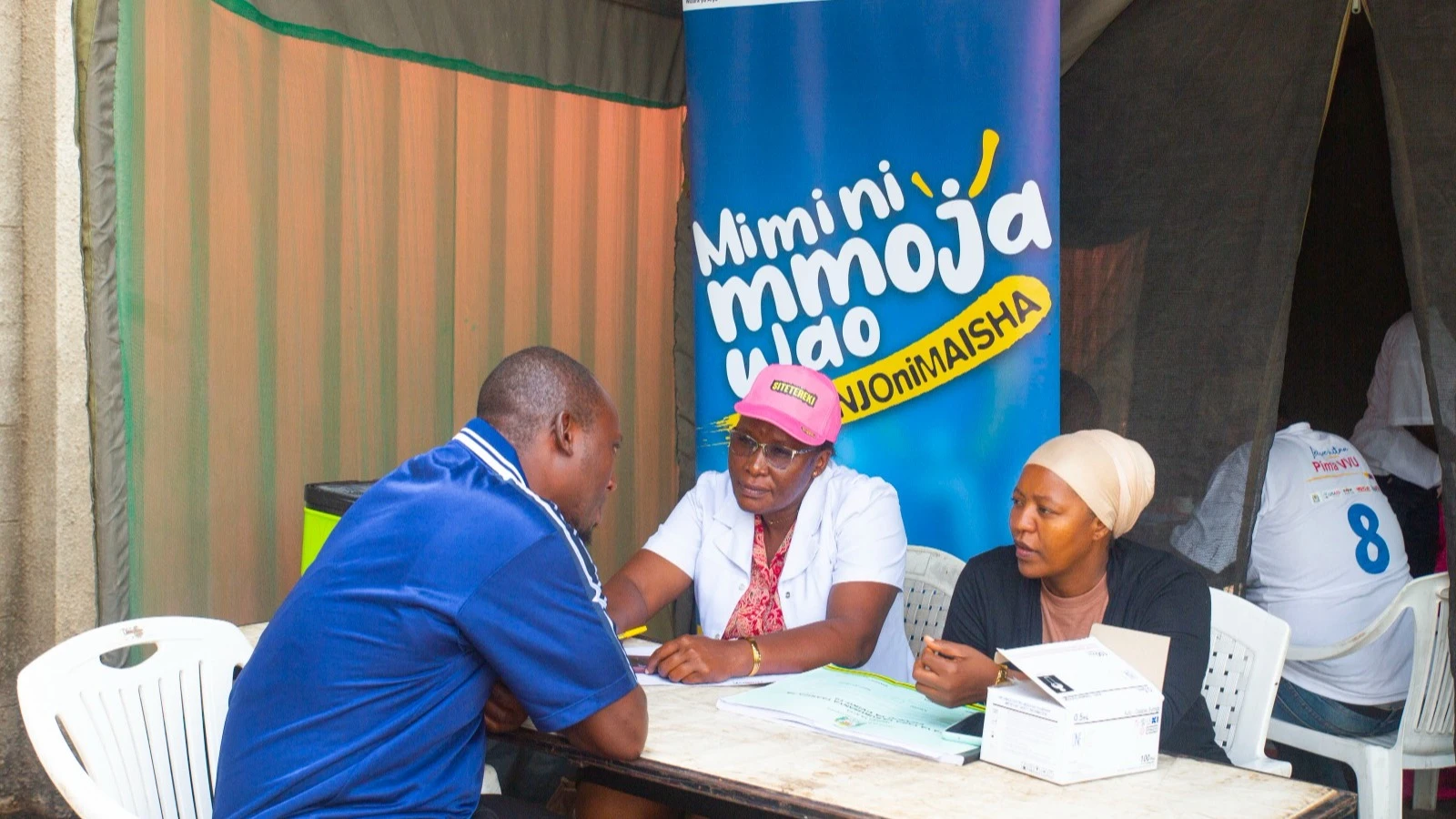 Ubungo Municipal Nurse Farida Mussa offers counselling to Hassan Juma who is a Dar es Salaam resident during the Ndondo Cup 2024 final which took place over the weekend in Dar es Salaam.