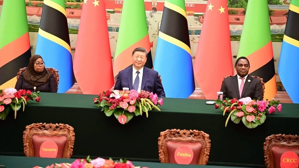 PRESIDENT Samia Suluhu Hassan (Left), Chinese President Xi Jinping, (Centre) and Zambian President Hakainde Hichilema (Right) jointly witnessing the signing of a Memorandum of Understanding on the revitalization project of the TAZARA railway.