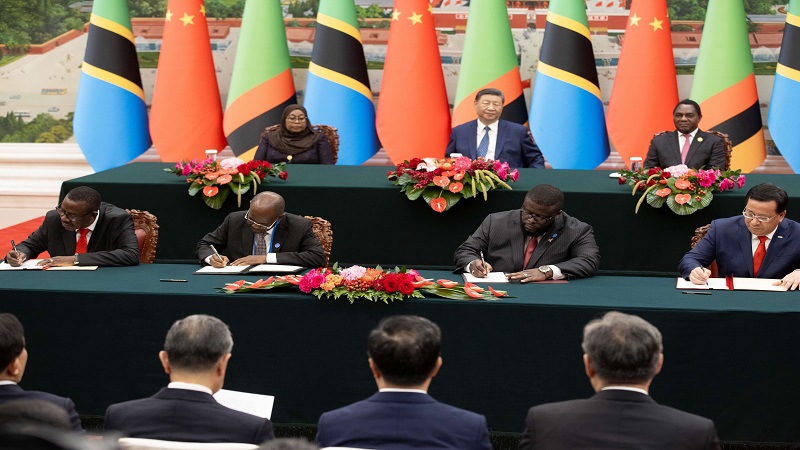 President Dr Samia Suluhu Hassan (L), host President Xi Jinping (C) and Zambia’s President Hakainde Hichilema witness the signing of a memorandum of understanding to improve the Tanzania Zambia Railway (TAZARA) and its managerial structures in Beijing .