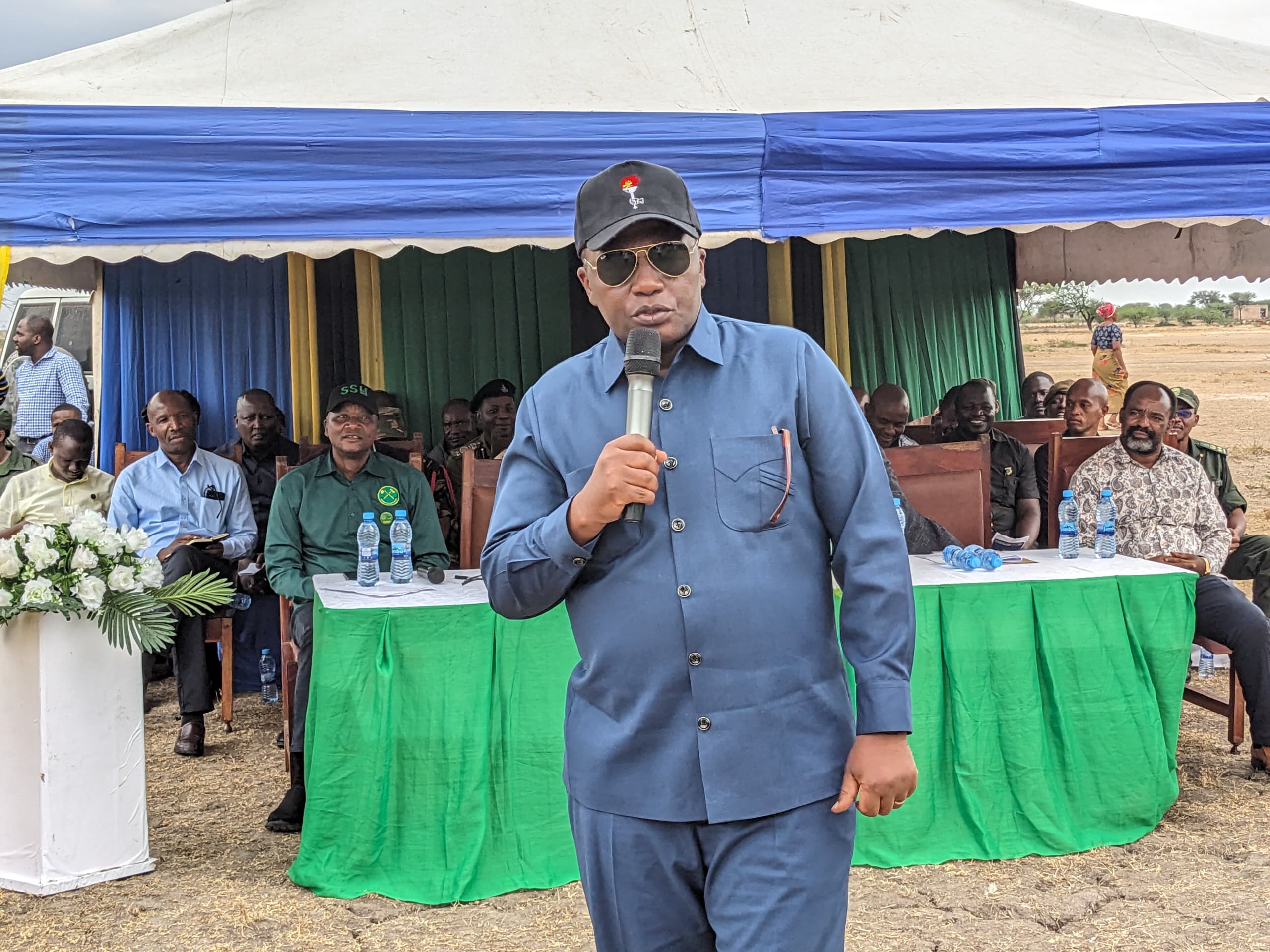 Mara regional commissioner Col Evans Mtambi addresses residents of Nyatwali ward in Bunda District yesterday on progress made by the government in compensating those earmarked for relocation from areas legally forming part of Serengeti National Park. 