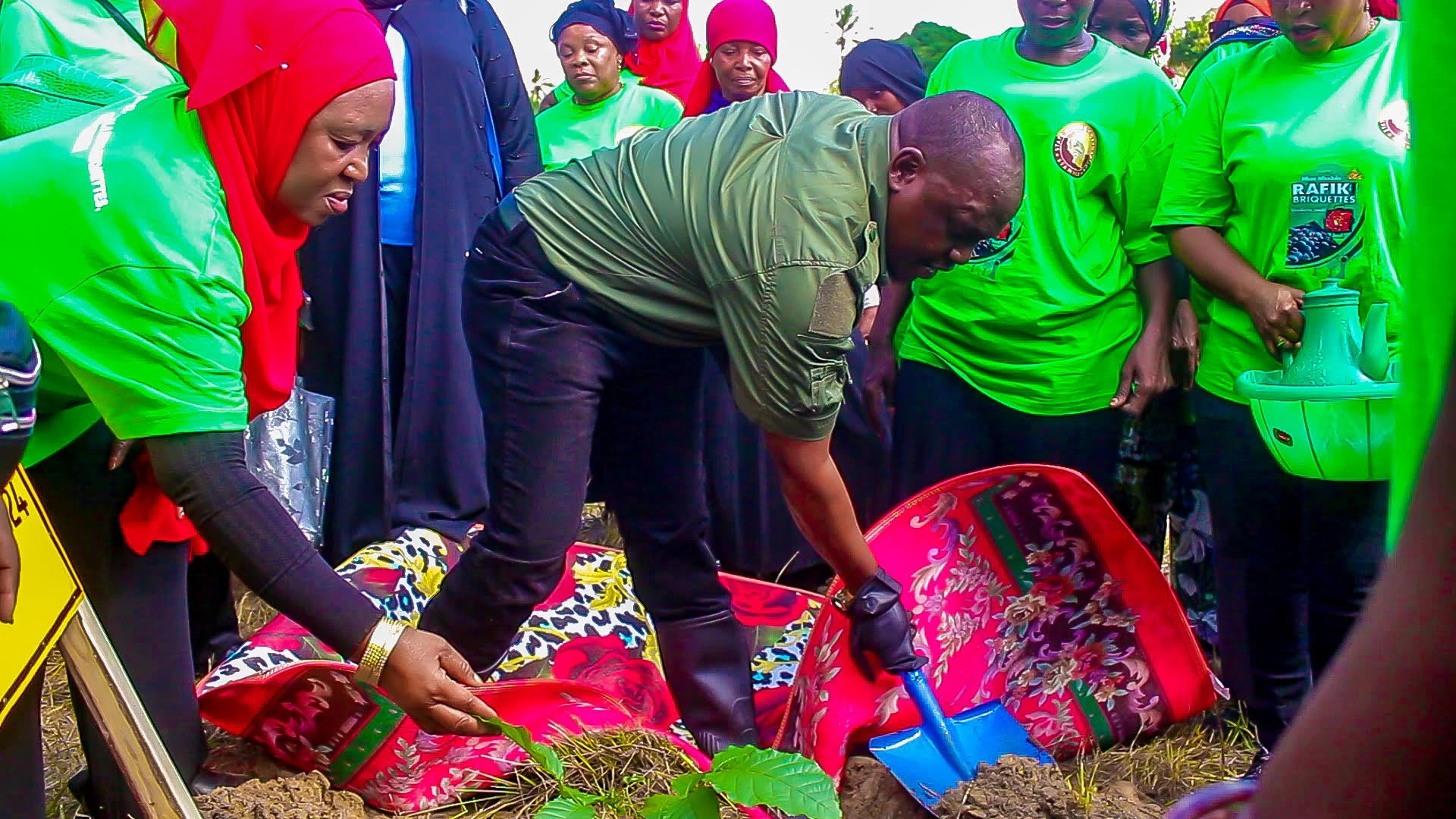 STAMICO Director, Dr. Venance Mwase(R), participates in a tree-planting exercise in Amboni, Tanga region.