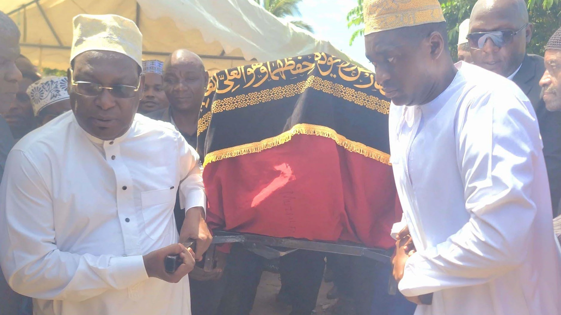 Chadema national Chairman Freeman Mbowe (L) lends a hand in moving the casket bearing the body of Ally Mohamed Kibao shortly before the burial of the opposition party’s cadre in Tanga yesterday. Kibao was found dead at the weekend.