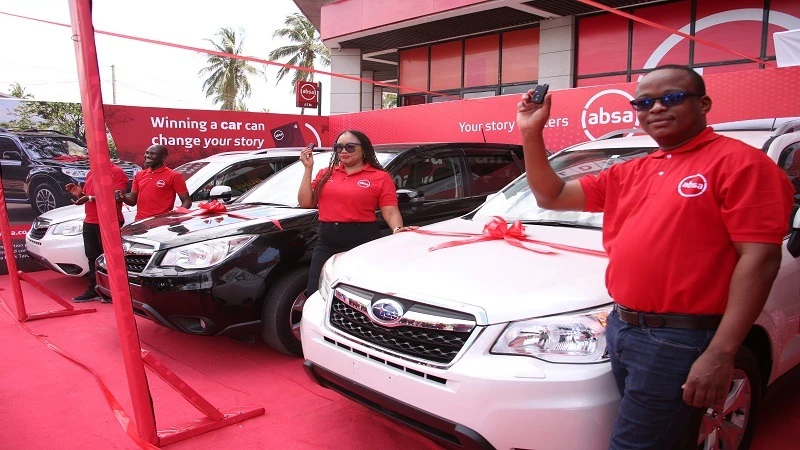 Absa Bank Tanzania Chief Financial Officer Bernard Tesha (R), Head of Retail Banking Ndabu Swere, and Marketing and Communications Manager Beda Biswalo display the keys to three brand-new 2024 Subaru Forester cars to be awarded to winners .