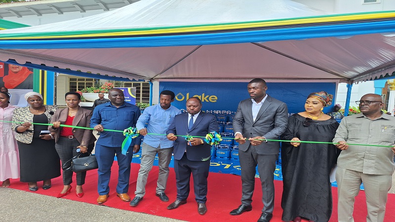 Dar es Salaam regional commissioner Albert Chalamila (C) pictured on Thursday cutting the ribbon to launch the distribution of a total of 1,000 cooking gas cylinders 