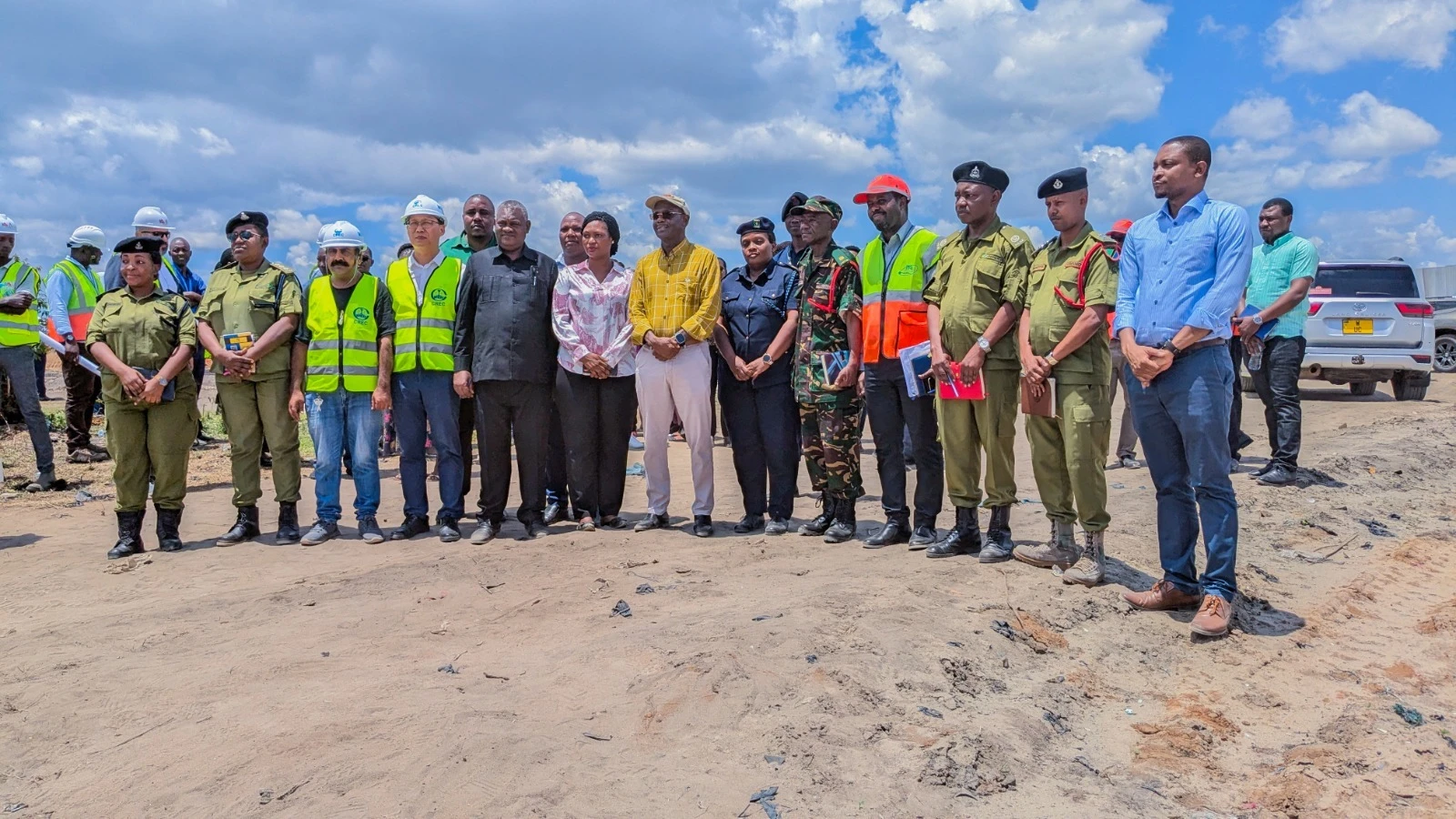 Transport minister Prof Makame Mbarawa (C) with members of the Tanzania Ports Authority staff, various government officials and China Railway Major Bridge Engineering Group Limited employees during his tour of the Dar es Salaam Port yesterday. 