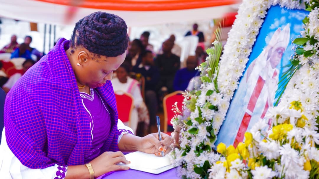 Dorothy Semu, Leader of the opposition ACT-Wazalendo, signs a condolence book at Mwanga town yesterday in mourning Bishop Chediel Sendoro, former head of the Mwanga Diocese of the Evangelical Lutheran Church in Tanzania. 