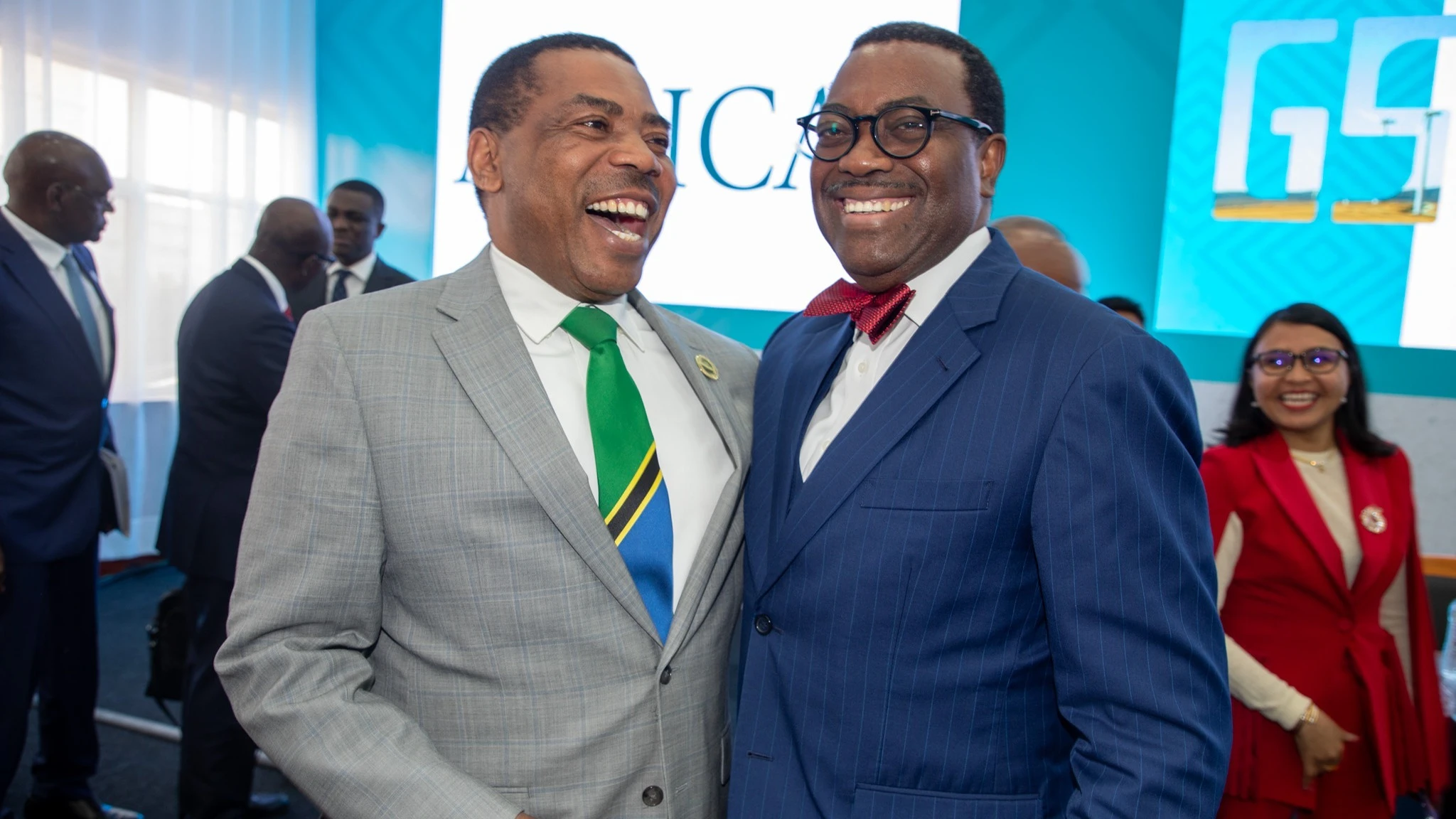 Finance minister Dr Mwigulu Nchemba (L) in jovial mood with Africa50 Institute Board of Directors chairman and African Development Bank (AfDB) President Dr Akinwumi Adesina. 