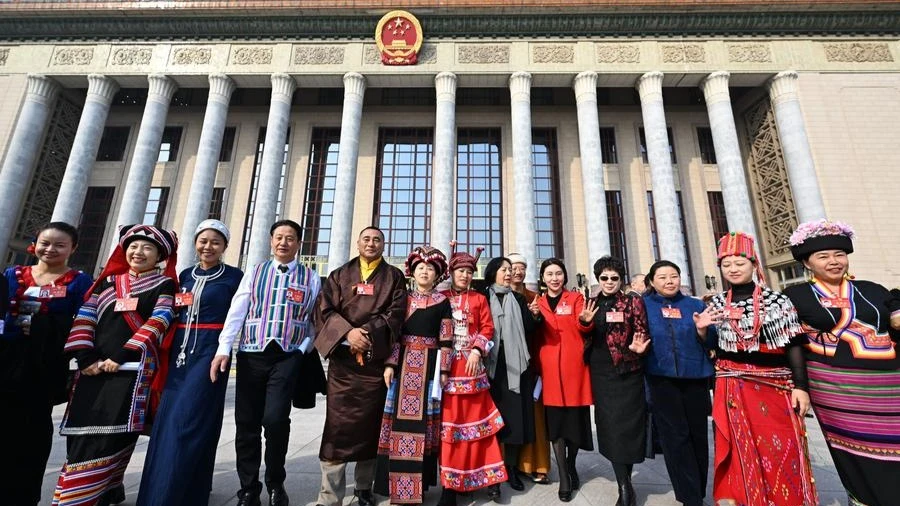 Members of the 14th National Committee of the Chinese People's Political Consultative Conference (CPPCC) leave the Great Hall of the People after the closing meeting of the second session of the 14th CPPCC National Committee in Beijing, capital of China, 