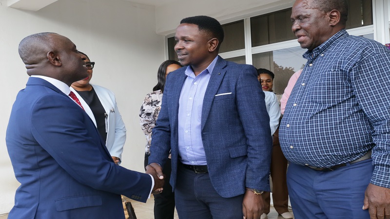 The Guardian Ltd deputy general manager Jackson Paul (C) pictured welcoming Ecobank Tanzania managing director Dr Charles Asiedu to the TGL offices in Dar es Salaam yesterday. The guest was on a familiarisation tour of the firm