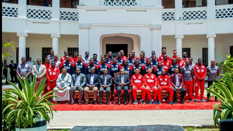 Zanzibar President Dr Hussein Mwinyi pictured yesterday in a group photo with Simba Sports Club’s leaders, technical bench and players when they visited the Zanzibar’s State House. Simba will lock horns with Azam at the New Amaan Complex in Zanzibar today