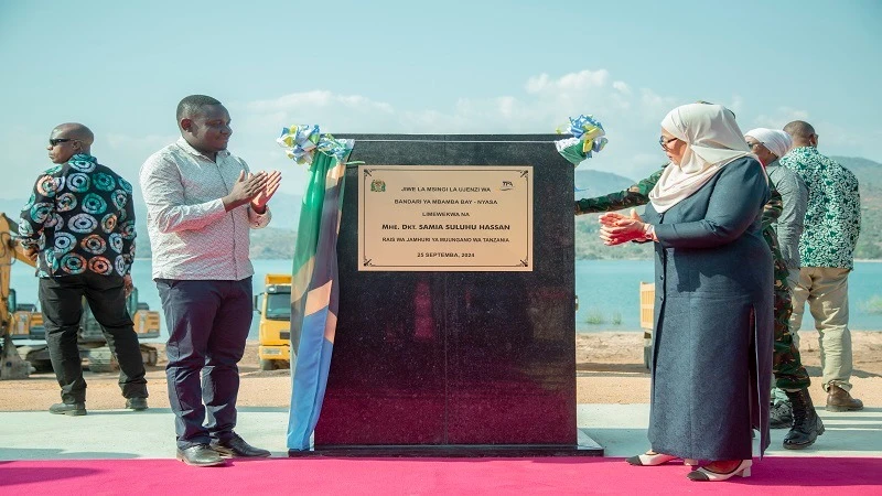 President Samia Suluhu Hassan lays a foundation stone for the design and construction of the new Mbamba Bay Port in Nyasa District, Ruvuma Region, yesterday, billed at 81bn/-. David Kihenzile, the Transport deputy minister.