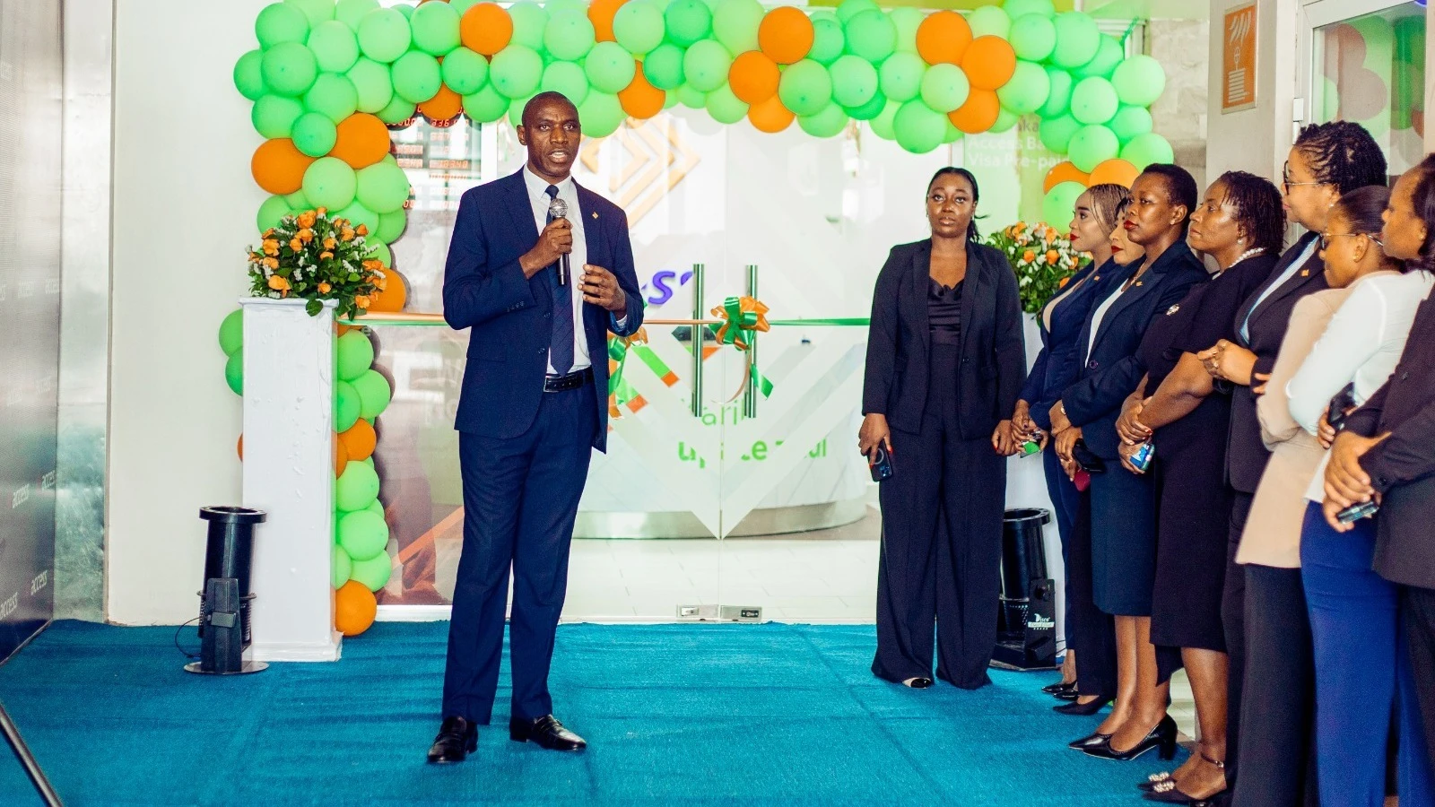 
Seyi Kumapayi, Executive Director of African Subsidiaries at Access Bank shares a word with business partners and Access Bank staff at the event the announce the full acquisition of the African Banking Corporation (Tanzania) Limited.