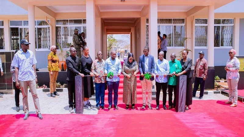 President Samia Suluhu Hassan cuts the ribbon to inaugurate Dr Samia Suluhu Hassan Girls’ Secondary School at Migeregere village in Namtumbo District, Ruvuma Region, yesterday. 