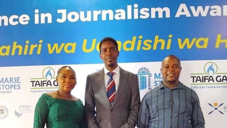 Sanula Athanas (C), Halfan Chusi (R), and Christina Mwakangale, at a ceremony held in Dar es Salaam.